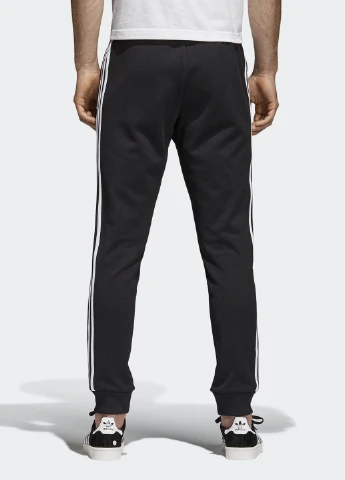 Черные спортивные демисезонные зауженные брюки adidas
