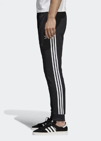 Черные спортивные демисезонные зауженные брюки adidas