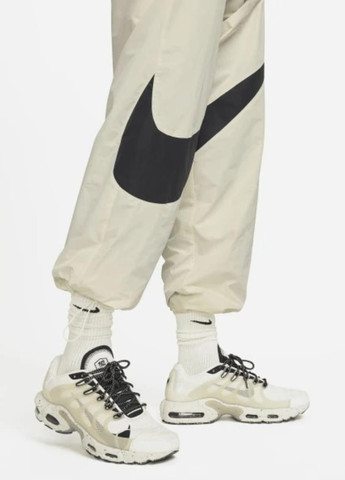 Бежевые спортивные демисезонные прямые брюки Nike