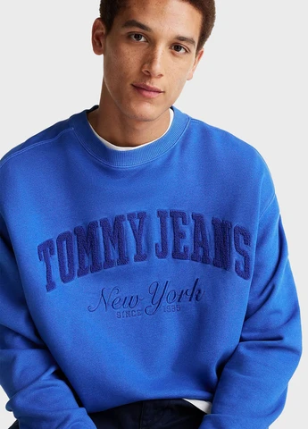 Синій світшот Tommy Jeans однотонний вишивка (347228171)