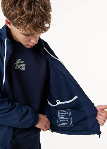 Темно-синя демісезонна вітровка Lacoste