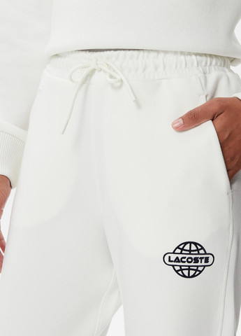 Молочные спортивные демисезонные прямые брюки Lacoste