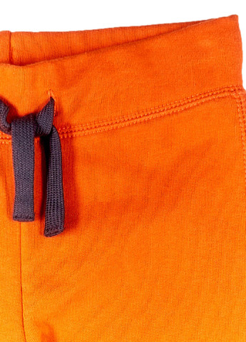 Оранжевые кэжуал демисезонные брюки зауженные United Colors of Benetton