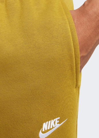 Горчичные спортивные демисезонные зауженные брюки Nike