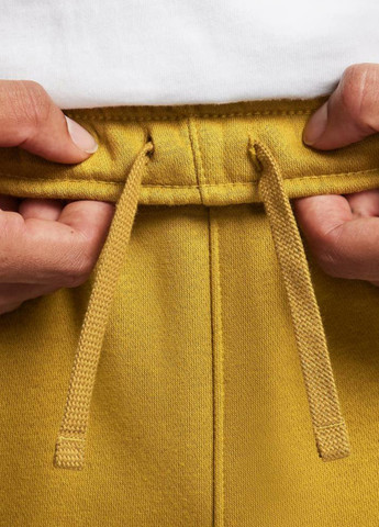 Горчичные спортивные демисезонные зауженные брюки Nike