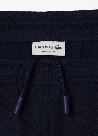 Темно-синие спортивные демисезонные прямые брюки Lacoste