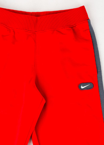Красные спортивные демисезонные прямые брюки Nike