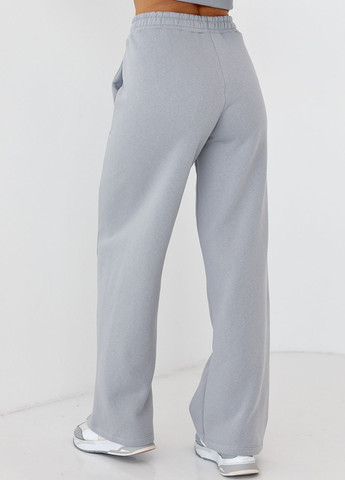 Утепленные трикотажные штаны с карманами Lurex (266994003)