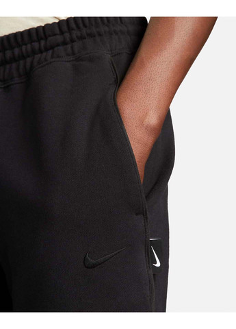 Черно-белые спортивные демисезонные брюки Nike