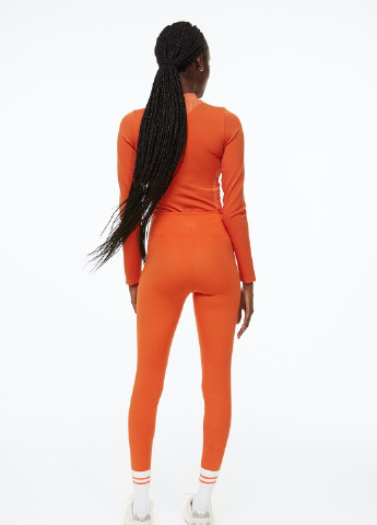 Оранжевые демисезонные леггинсы H&M