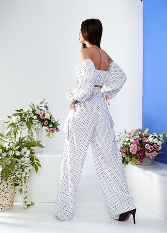 Жіночий костюм топ і штани палаццо білого кольору р.L 387296 New Trend (257611048)
