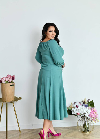 Зелена костюм жіночий блуза та спідниця кольору оливка р.50/52 431387 New Trend