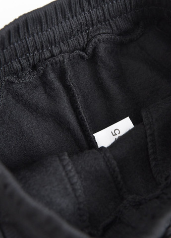 Спортивні штани дитячі для хлопчика на флісі чорного кольору Let's Shop (273901272)
