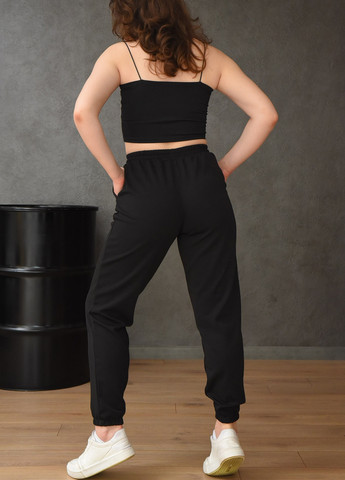 Штани спортивні жіночі з тканини лакоста чорного кольору Let's Shop (257817344)