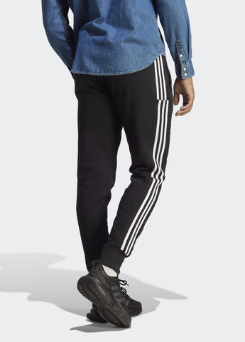 Штани Essentials French Terry Tapered Cuff 3-Stripes adidas (276839126)