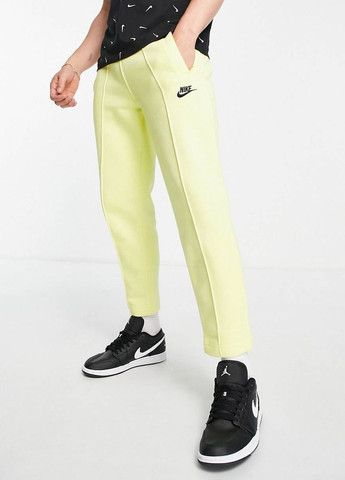 Желтые спортивные демисезонные брюки Nike