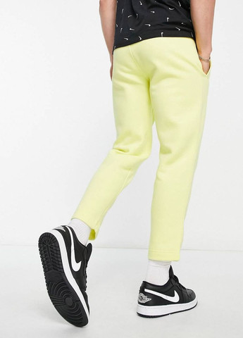 Желтые спортивные демисезонные брюки Nike
