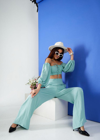 Женский костюм топ и брюки палаццо оливкового цвета 387262 New Trend (258685888)