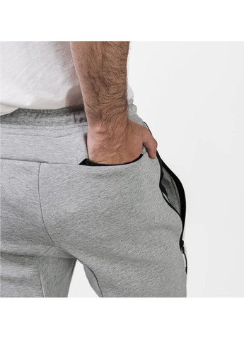 Серые демисезонные брюки Nike