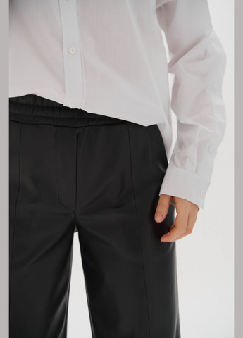Жіночі штани палаццо з еко шкіри колір чорний р.L 450866 New Trend (282926685)