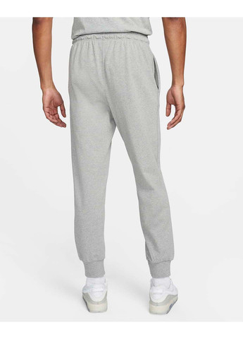 Серые демисезонные брюки Nike