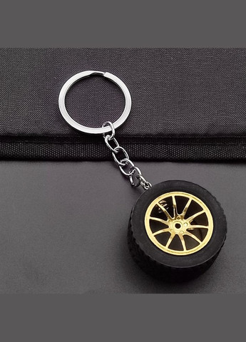 Брелок у вигляді автомобільного колеса з золотим диском No Brand (346440127)