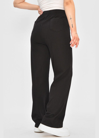 Штаны женские расклешенные полубатальные черного цвета Let's Shop (347623004)