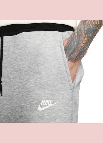 Серые демисезонные брюки Nike