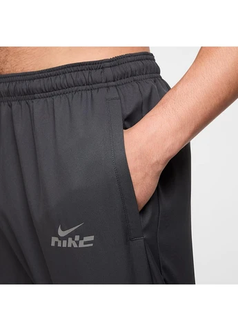 Серые демисезонные брюки Nike