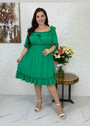 Зеленое платье любопытного кроя Україна однотонное