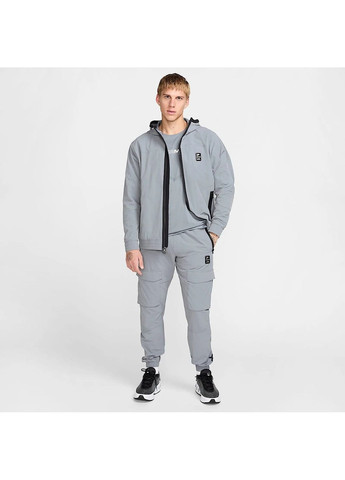 Серые демисезонные брюки Nike