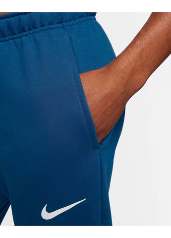 Синие демисезонные брюки Nike