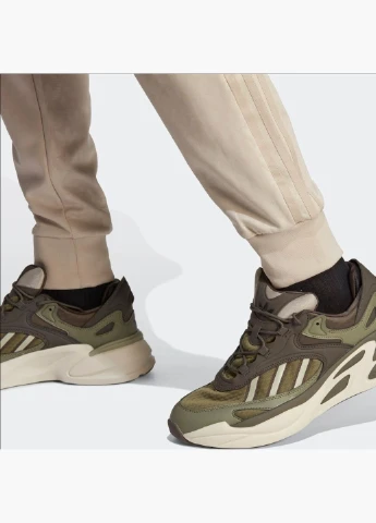 Штани чоловічі Graphics Monogram Sst Trackpant Beige IJ5690 adidas (332610262)