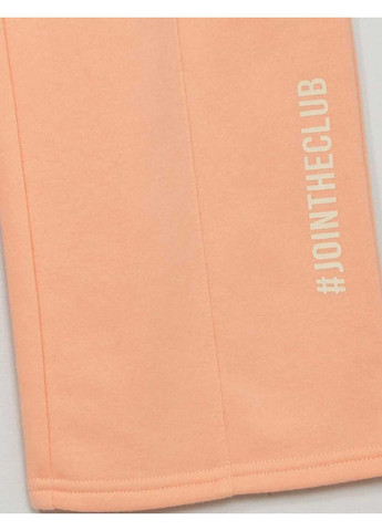 Персиковые брюки Kiabi