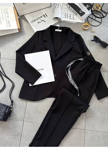 Жіночий костюм з піджаком і штанами Україна (355803404)
