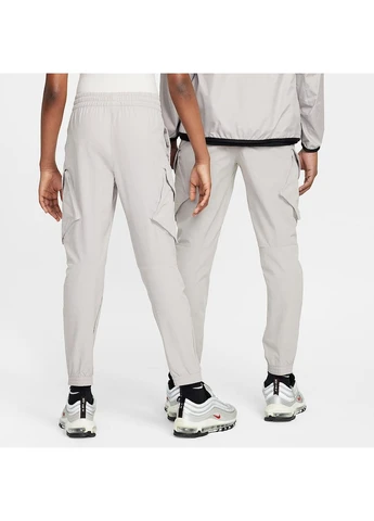 Серые демисезонные брюки Nike