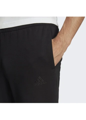 Штани Essentials Fleece Tapered Cuff Logo Pants Black GK8966 adidas (397854364)