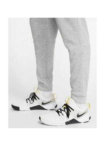 Серые демисезонные брюки Nike