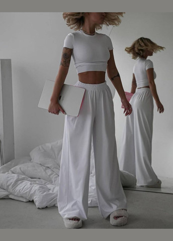 Жіночий костюм топ і штани палаццо колір білий р.46/48 452630 New Trend (285711312)