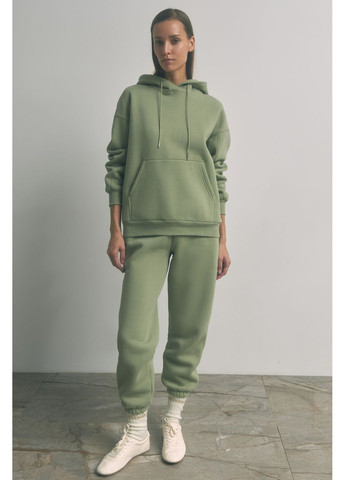 Салатовое демисезонное Женское пальто Йораль 140961 Stimma