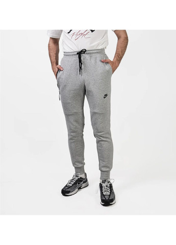 Серые демисезонные брюки Nike