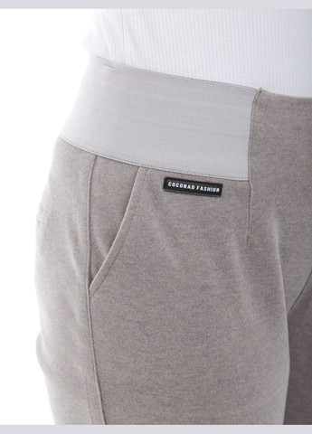 Штани жіночі бежеві теплі з гумкою на поясі Estensivo MOM (305850848)