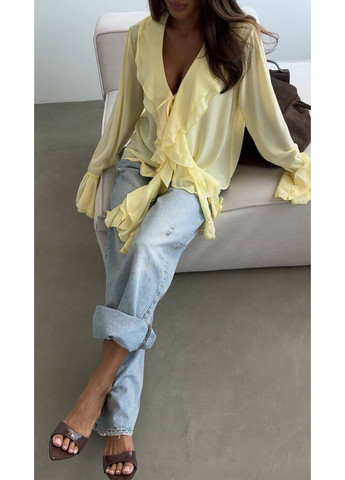 Жовта жіноча блуза з воланами Avanti