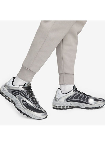 Серые демисезонные брюки Nike