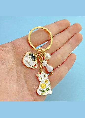 Брелок золотистий з підвісками котики LuxAurum305 Liresmina Jewelry (347151311)