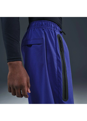 Синие демисезонные брюки Nike