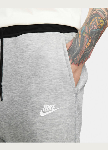 Серые демисезонные брюки Nike