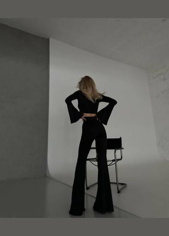 Жіночий костюм топ і штани клеш колір чорний р.46/48 452382 New Trend (285711589)
