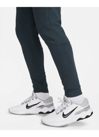 Синие демисезонные брюки Nike
