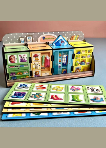 Дерев'яна настільна гра "Шафи з одягом" (ПСД061) PSD061 сортер-комодик Ubumblebees (316272301)